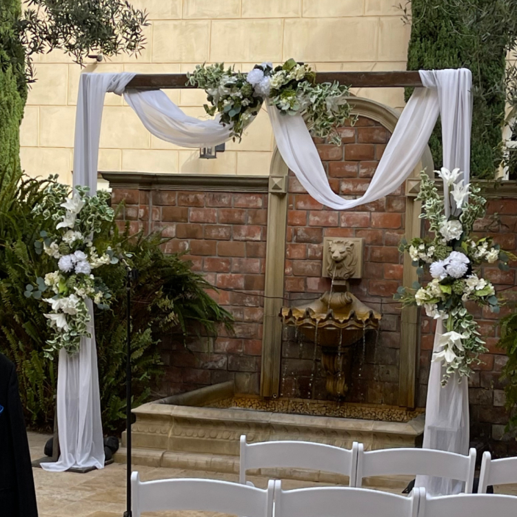 Wedding arch with flowers and drape